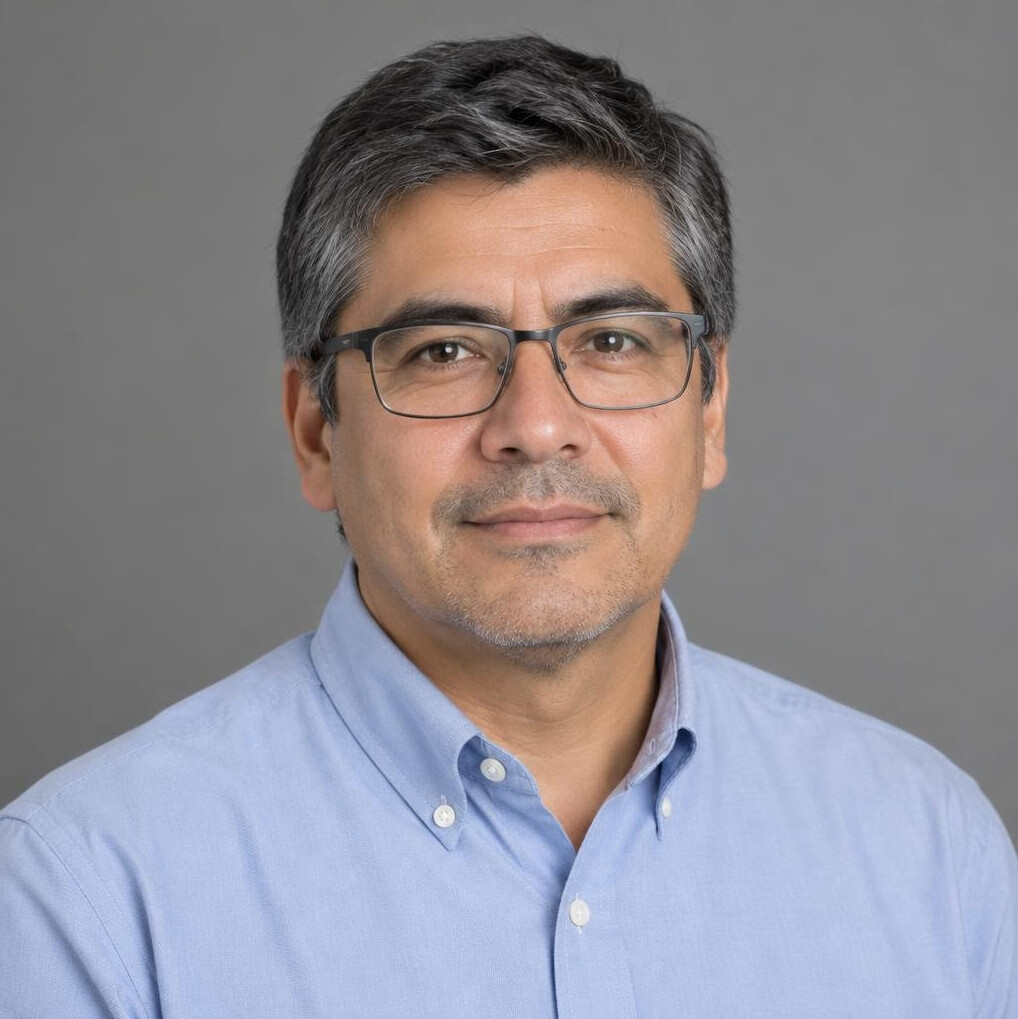 Studio portrait of a Chilean male photo editor wearing glasses