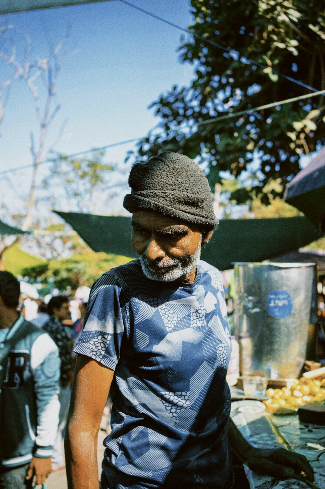 Candid portrait of an elderly Chilean street vendor smiling